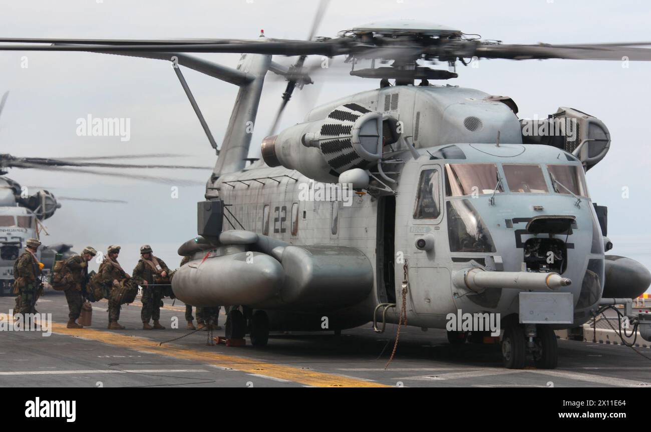 Marines with 3rd Battalion, 2nd Marine Regiment, Battalion Landing Team, 22nd Marine Expeditionary Unit board a CH-53E Super Stallion from Marine Heavy Helicopter Squadron 461 (Reinforced), 22nd MEU for their mission to Haiti, Jan. 19, 2010. Stock Photo