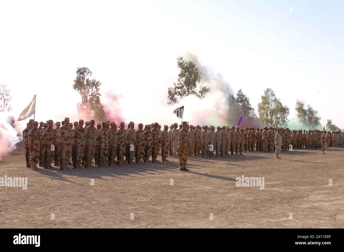 Nine platoons of Iraqi National Guard soldiers stand in formation at a graduation ceremony August 26 in Qayarrah, Iraq.  The soldiers participated in a four-week basic training course taught by Soldiers from Company C, 52nd Infantry Division, 3rd Brigade, 2nd Infantry Division (Stryker Brigade Combat Team) ca. August 26, 2004 Stock Photo