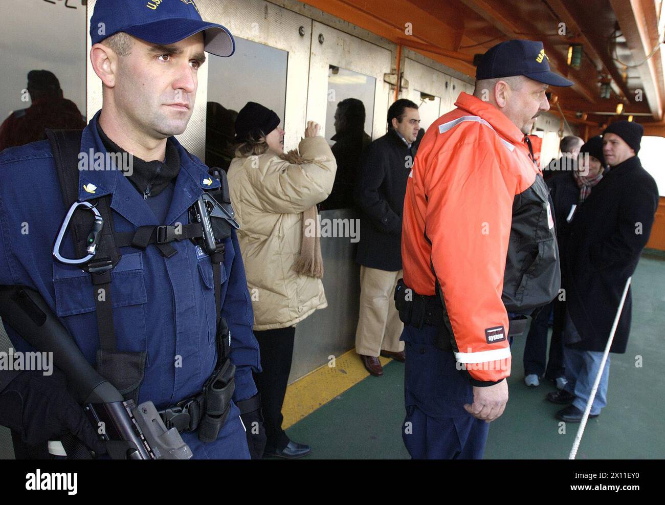 NEW YORK, New York (Jan. 8, 2004)--Petty Officer 3rd Class Chad Walder of Franklin Lakes, N.J., patrols a Staten Island Ferry with members of a commercial vessel boarding team January 8, 2004 in New York harbor. Stock Photo