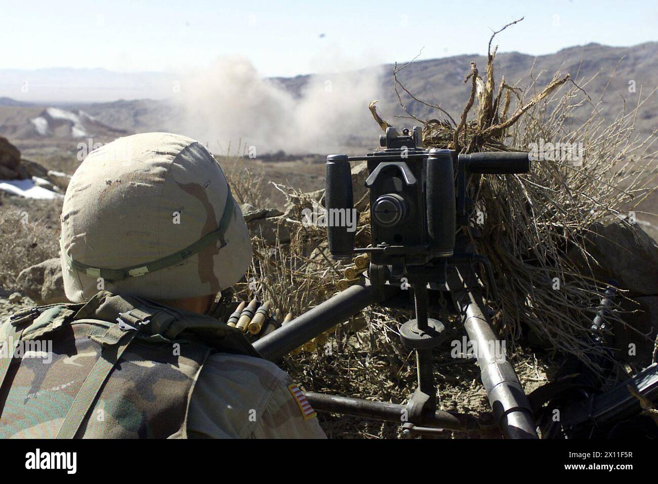 Original Caption: A U.S. Army Soldier with the 1st Battalion, 187th Infantry Regiment, 101st Airborne Division (Air Assault), mans a .50-caliber machine gun during a battle in Operation Anaconda, March 4, 2002. The battlefield is in eastern Afghanistan, south of Gardez in the Shah-e-kot mountain range ca. April 03, 2004 Stock Photo