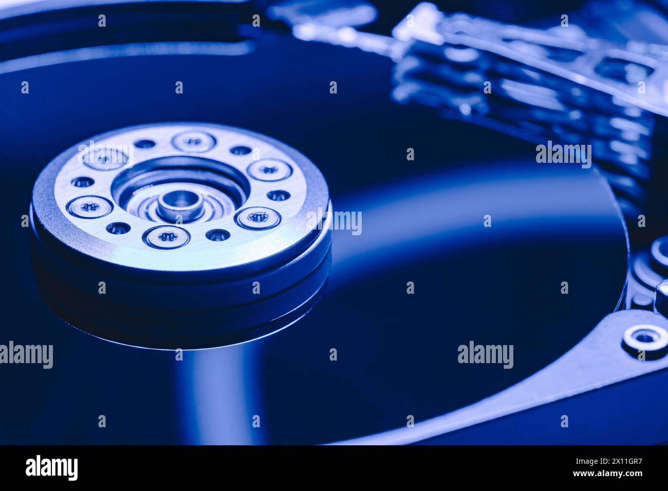 hard disk without top cover. computer hardware part. selective focus. Stock Photo
