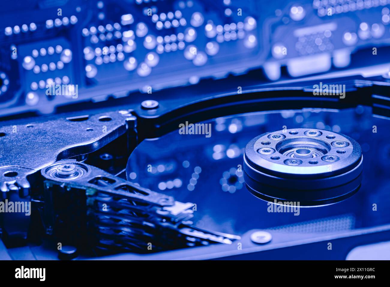 opened computer hard drive with reflections of circuit main board. selective focus. Stock Photo