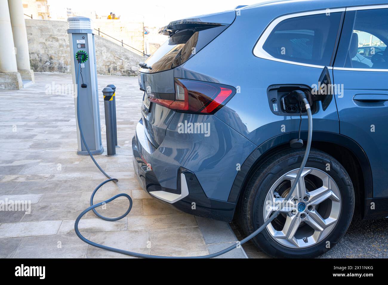 Valletta, Malta, April 03, 2024. an electric car charging in a parking
