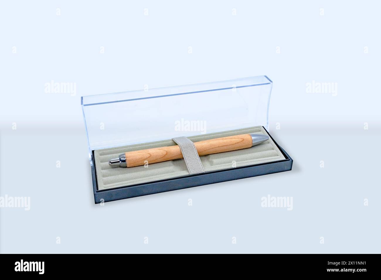 A very expensive looking wooden pen in a glass box Stock Photo