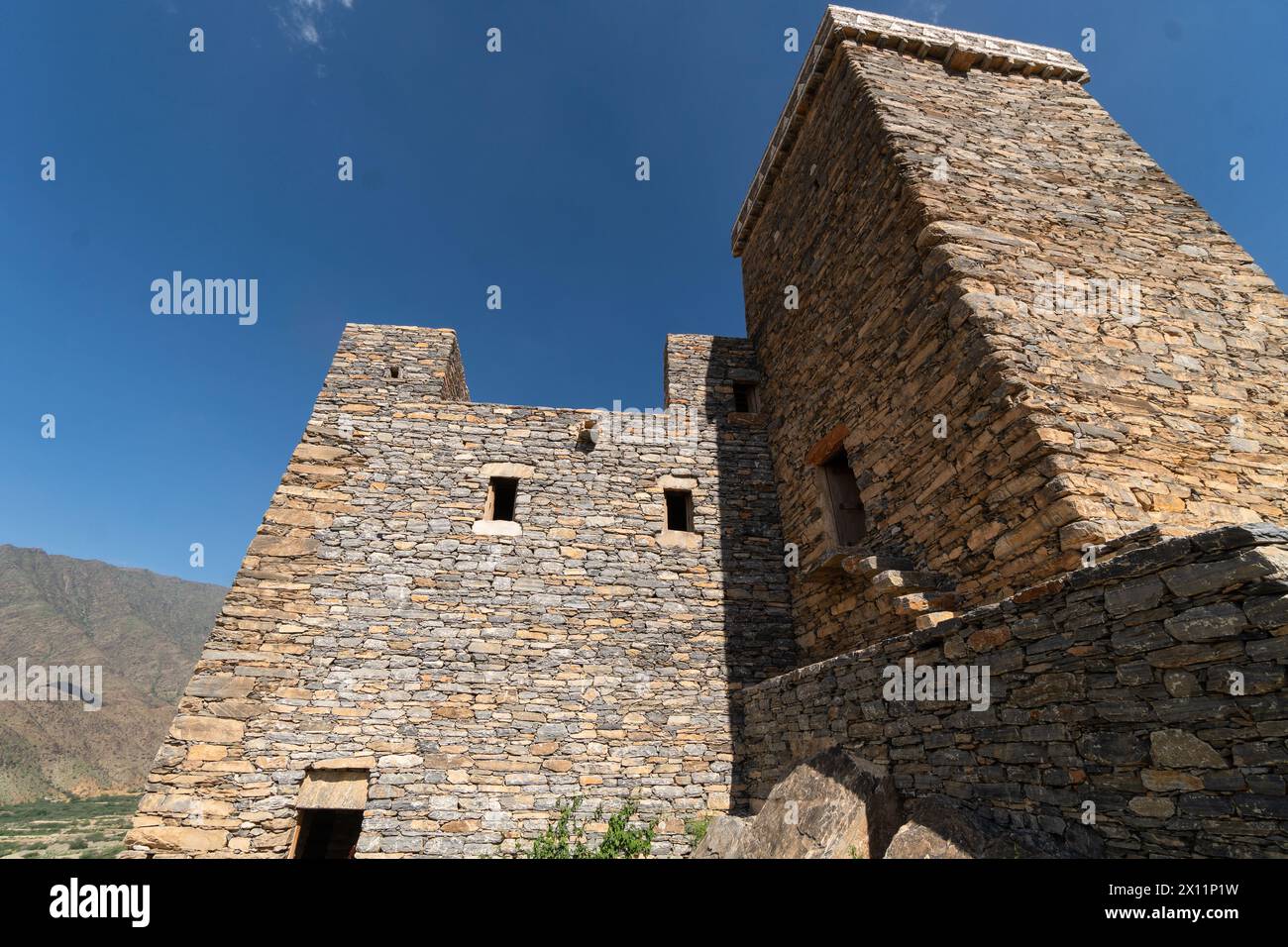 Al-Bahah, Saudi Arabia: Exterior view of the Thee Ain ancient village, known as the marble village, near Jeddah in Saudi Arabia on a hot sunny day. Stock Photo