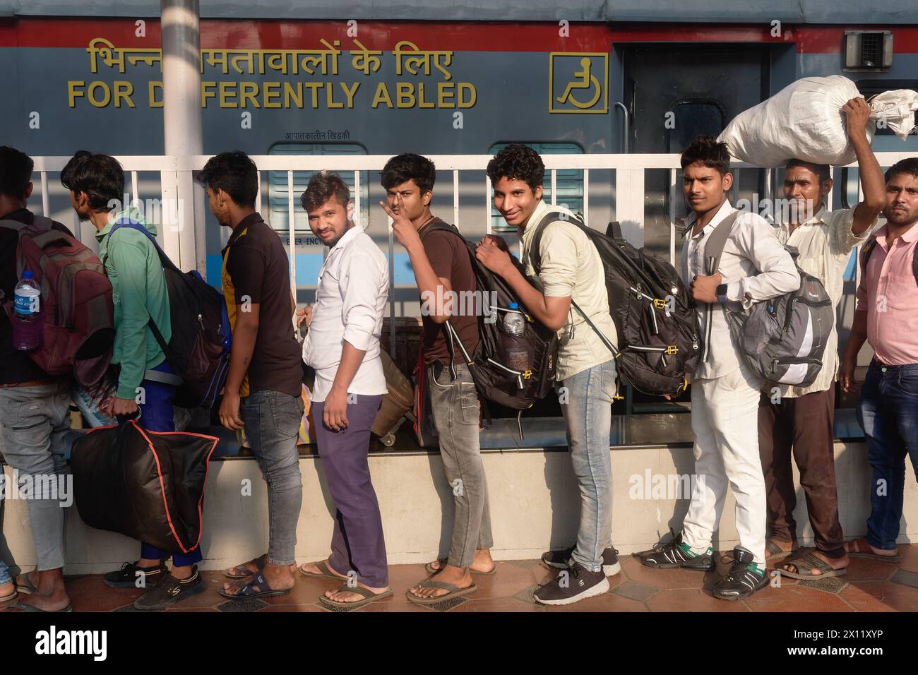 Migrant workers from Uttar Pradesh in North India queuing to board a ...