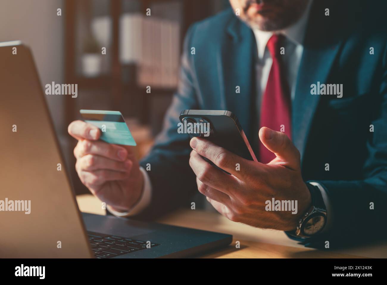 Entrepreneur using smartphone and credit card, electronic banking concept, selective focus Stock Photo