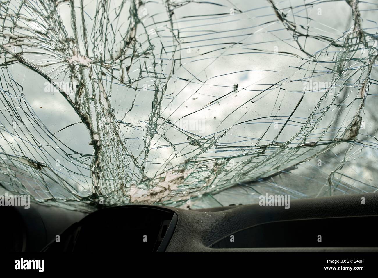 Broken glass texture, car windshield after traffic accident, shattered glass material background, selective focus Stock Photo
