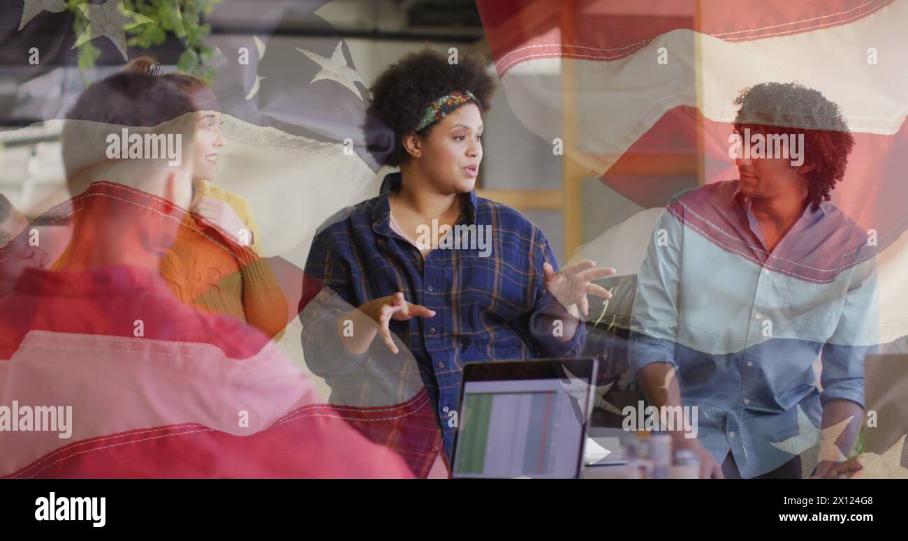 Image of flags of usa over diverse business people in office Stock Photo