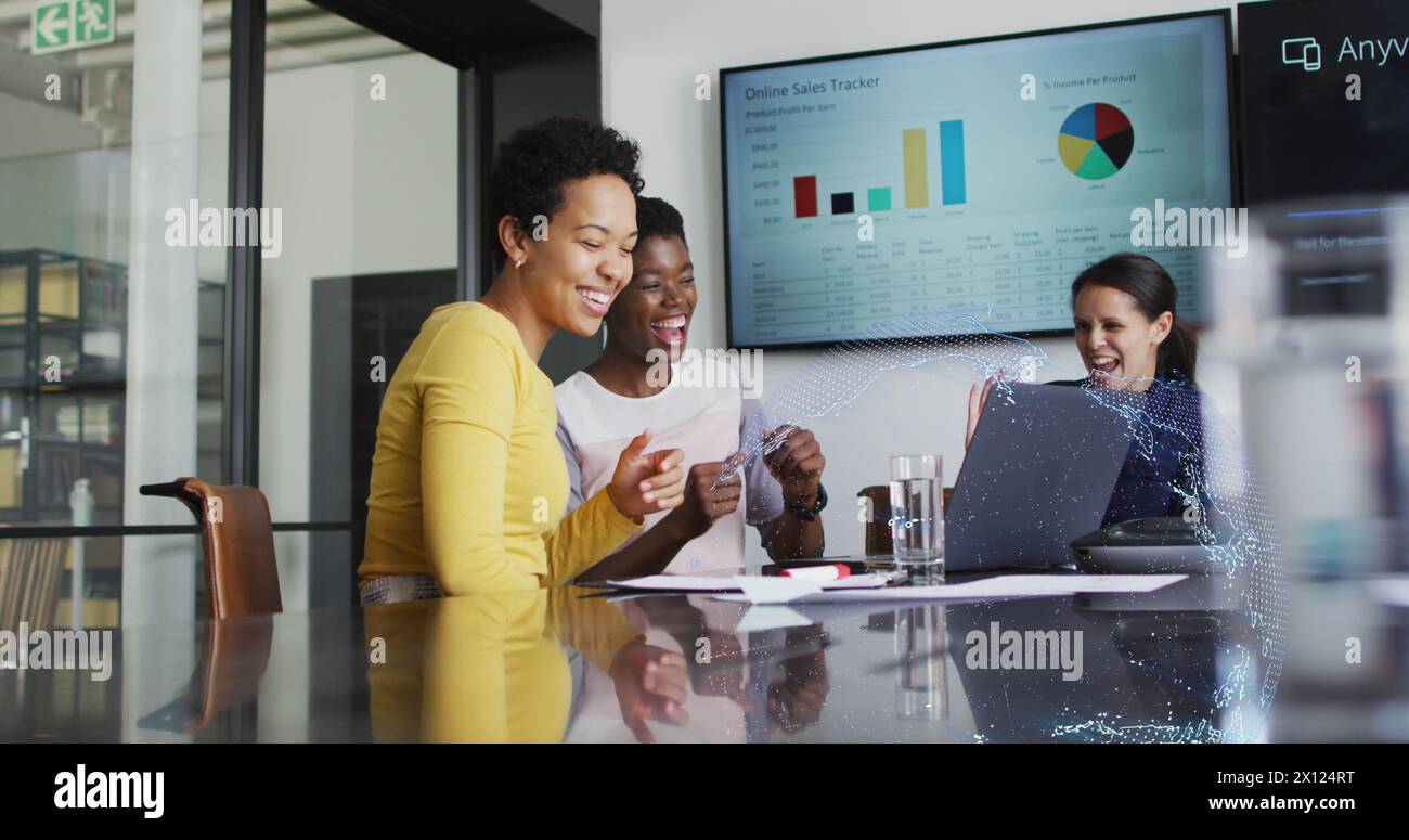Image of data processing and globe over diverse business people high fiving in office Stock Photo