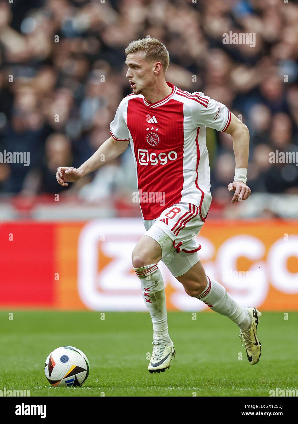 AMSTERDAM - Kenneth Taylor of Ajax during the Dutch Eredivisie match between Ajax Amsterdam and FC Twente at the Johan Cruijff ArenA on April 14, 2024 in Amsterdam, Netherlands. ANP | Hollandse Hoogte | MAURICE VAN STEEN Stock Photo