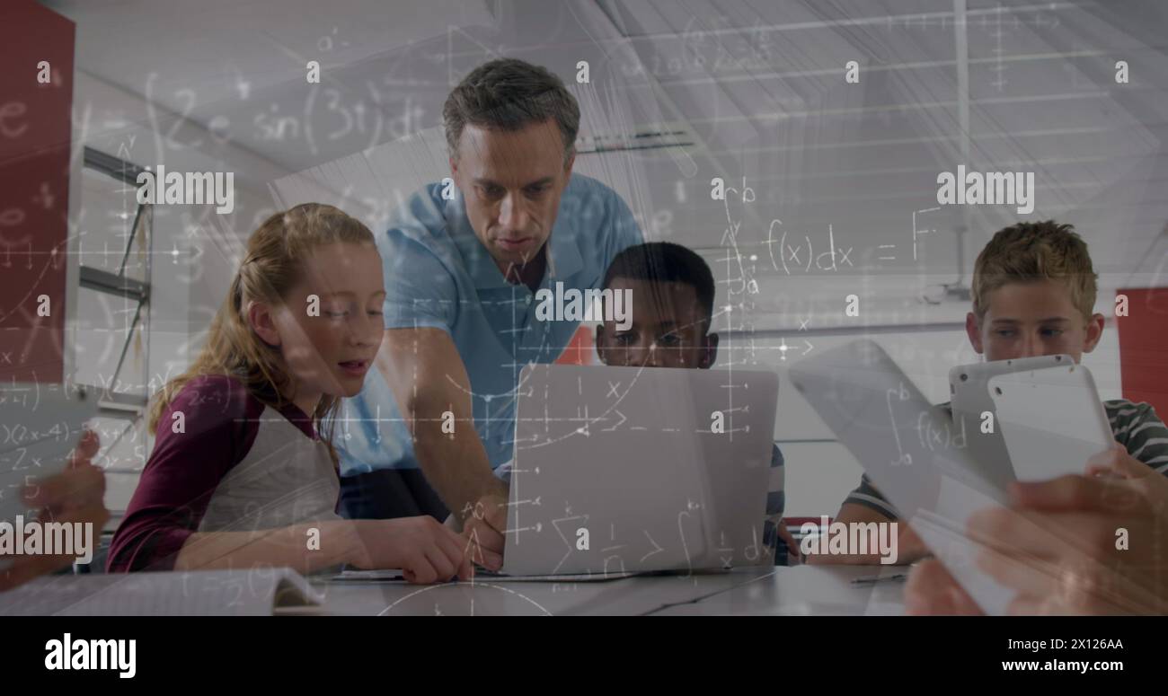 Image of math formulas moving over diverse male teacher and pupils working on laptop Stock Photo