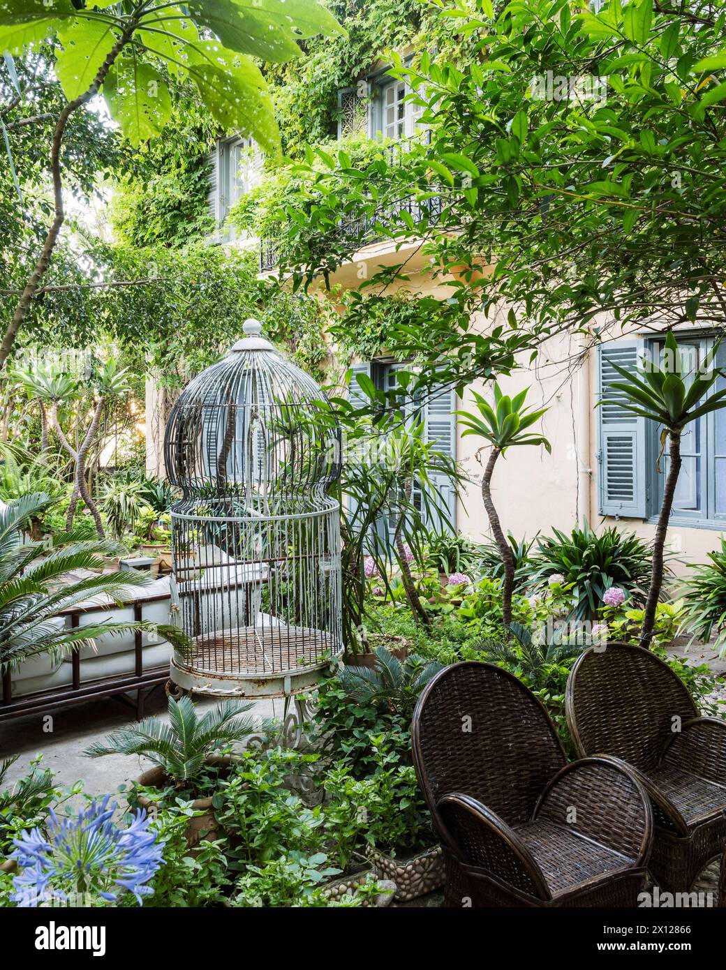 Bird cage on terrace outside Mimi Calpe, 1950s French luxury villa and hotel in Tangier, Morocco Stock Photo