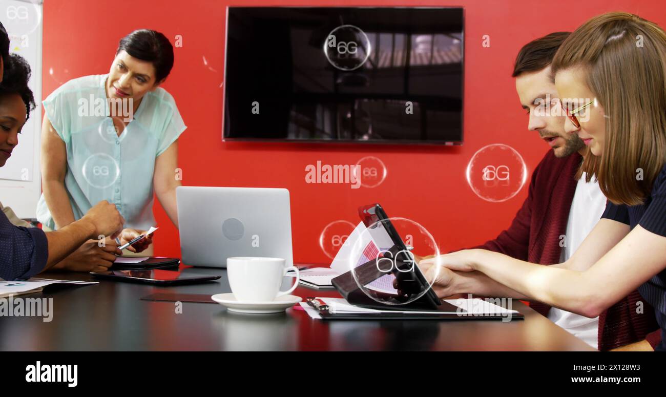 Image of 6g texts in bubbles over diverse coworkers analyzing reports