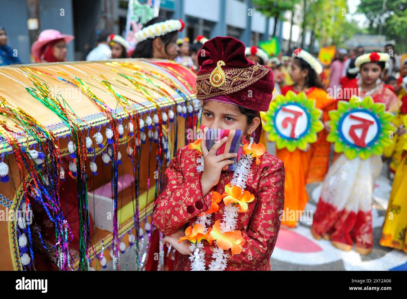 Sylhet, Bangladesh. 14th Apr, 2024. April 14, 2024, Sylhet, Bangladesh: A woman takes part during the Pathshala, the Bengali New Year 1431 Celebration ceremony in the first light of the dawn of Pahela Baisakh at the premises. Credit: Eyepix Group/Alamy Live News Stock Photo