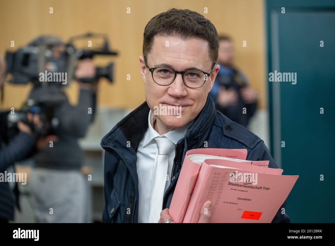 Trier, Germany. 15th Apr, 2024. Chief Public Prosecutor Eric Samel walks through the courtroom at the start of the trial. Credit: Harald Tittel/dpa/Alamy Live News Stock Photo