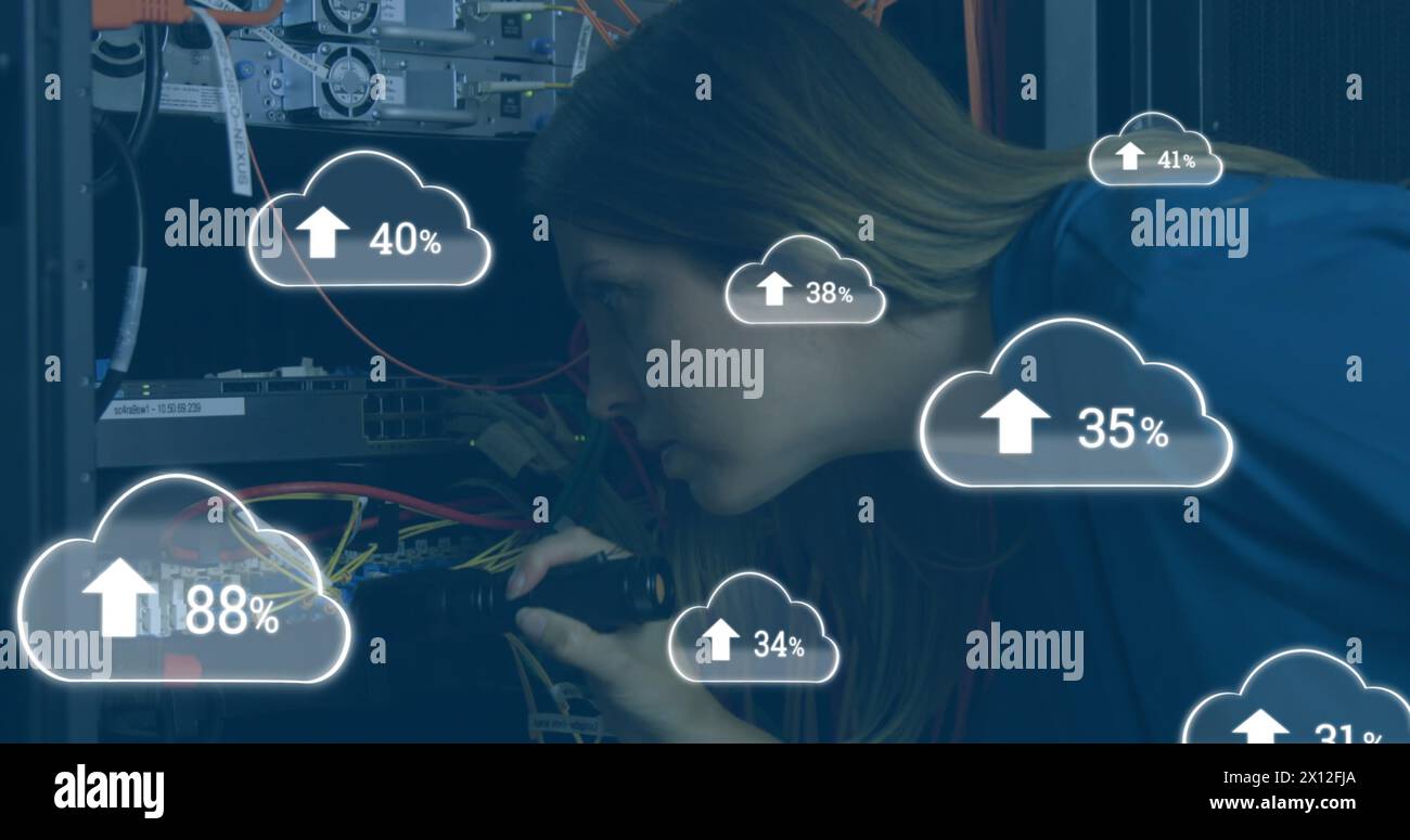 Image of clouds icons over caucasian female worker inspecting server ...