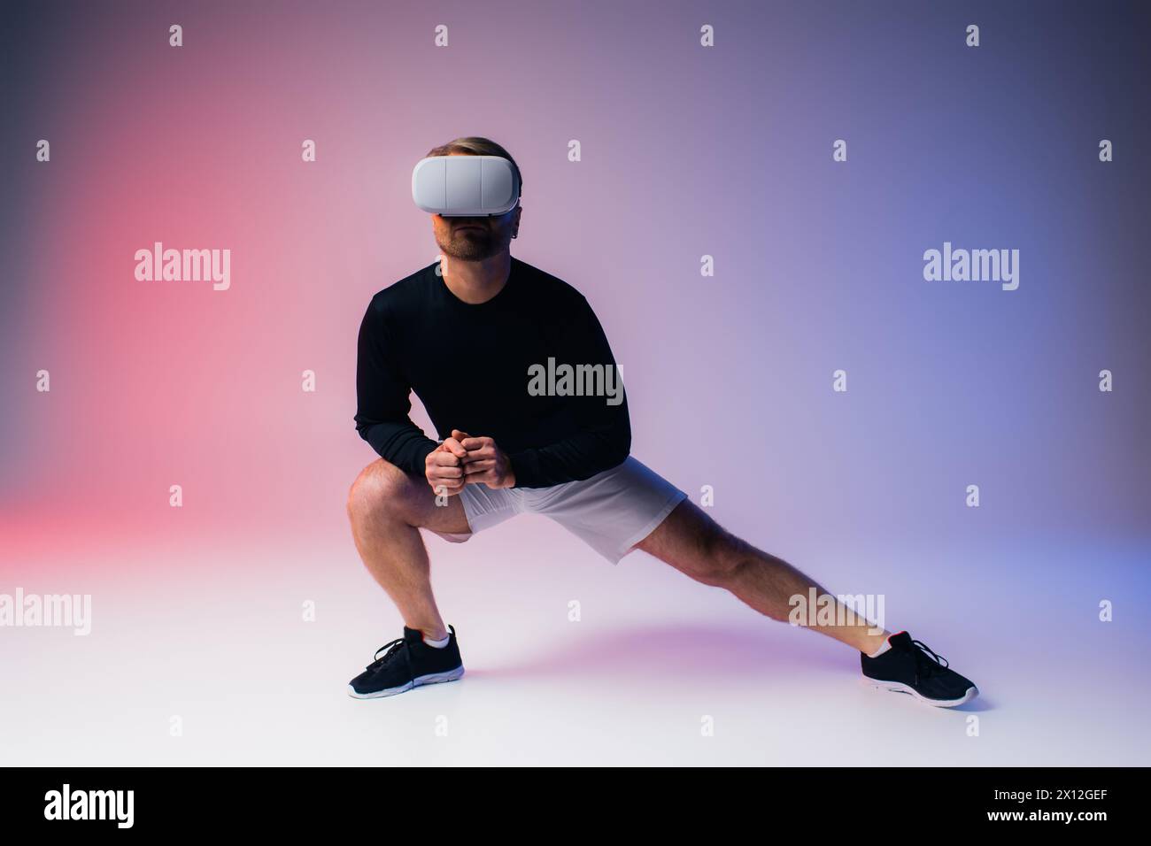 Vr Shorts A man in a black shirt and white shorts stands confidently in a studio ...