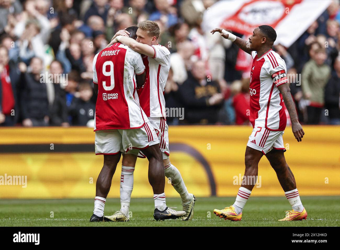 AMSTERDAM - (l-r) Brian Brobbey of Ajax, Kenneth Taylor of Ajax,a Steven Bergwijn of Ajax celebrate the 1-1 during the Dutch Eredivisie match between Ajax Amsterdam and FC Twente at the Johan Cruijff ArenA on April 14, 2024 in Amsterdam, Netherlands. ANP | Hollandse Hoogte | MAURICE VAN STEEN Stock Photo