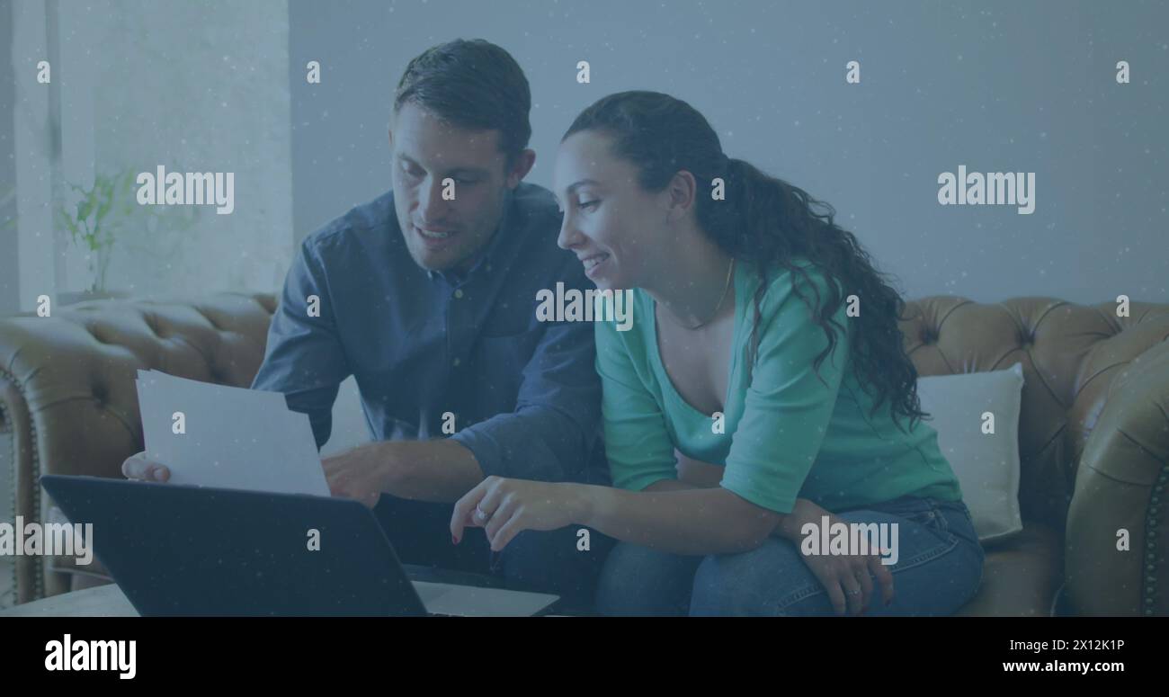 Image of icons with growing numbers over caucasian couple using laptop Stock Photo