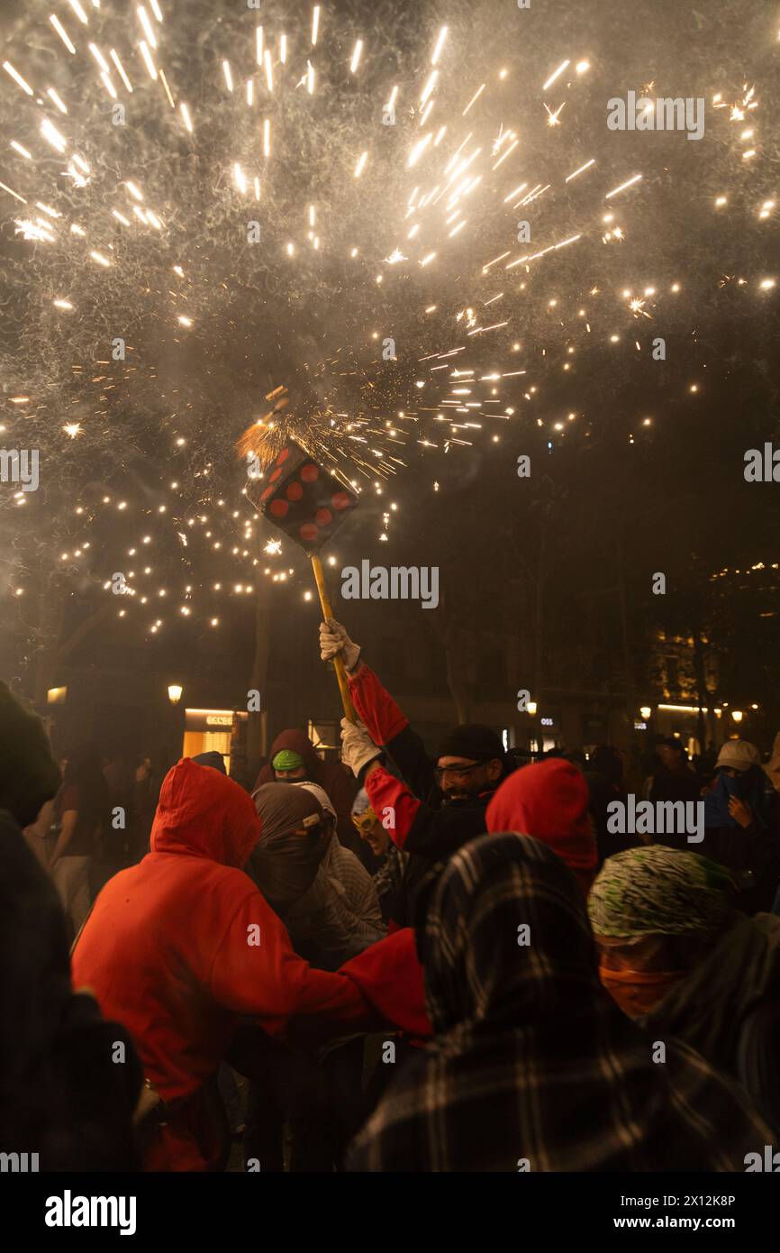 A Correfoc between a group of people in Barcelona Stock Photo - Alamy