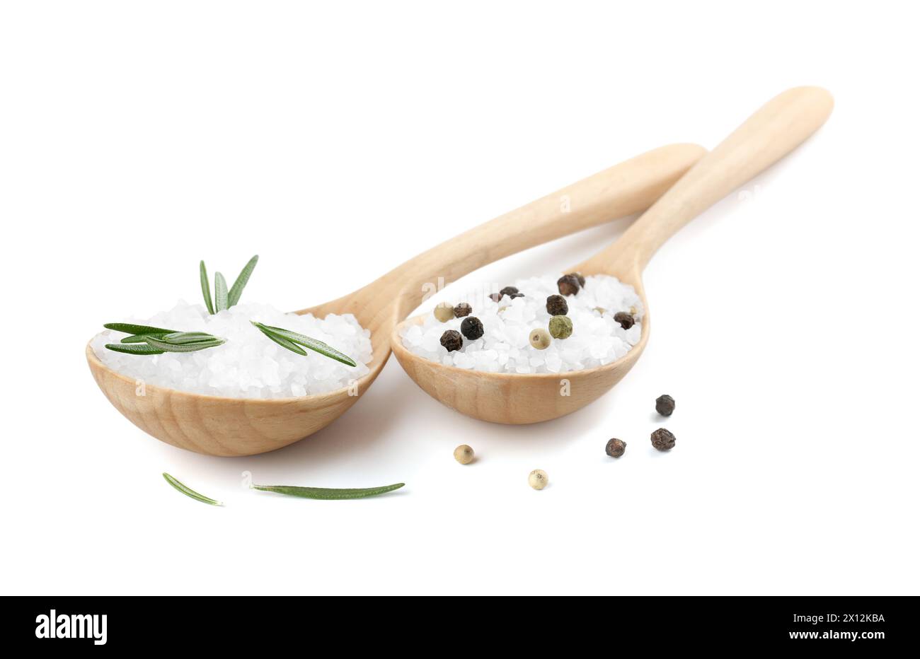 Salt with rosemary and peppercorns in spoons isolated on white Stock Photo