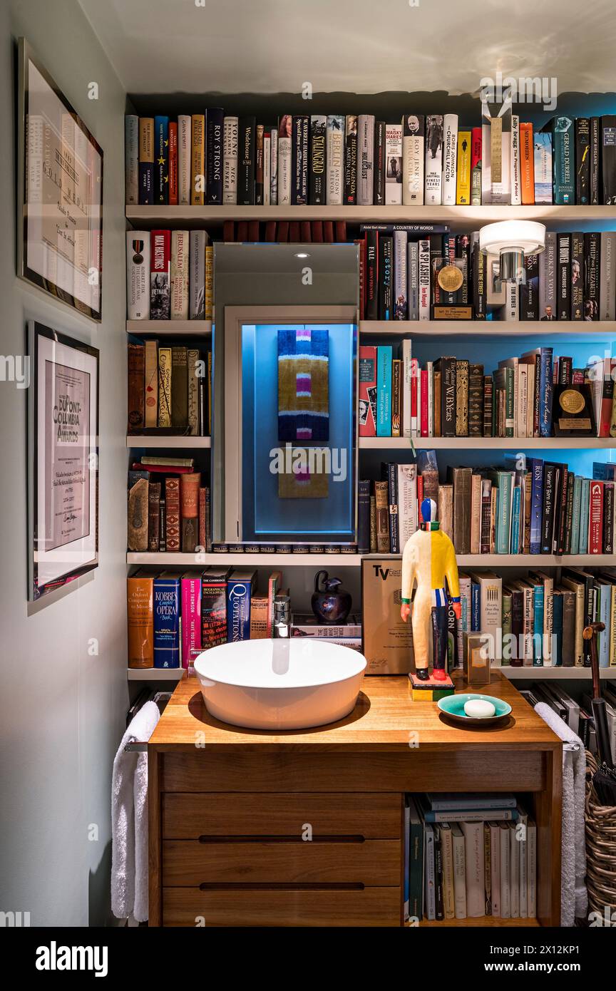 Bookshelves in wash room in Thames waterside residence, London, UK Stock Photo