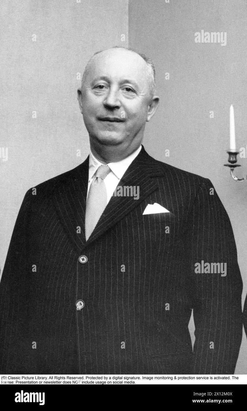 Christian Dior, born January 21, 1905 in Granville in Normandy, died October 23, 1957 in Montecatini Terme in Tuscany, Italy, was a French fashion designer. He is best known for founding the fashion house Dior and creating The New Look. Picture while being on a visit to Sweden 1957. Stock Photo