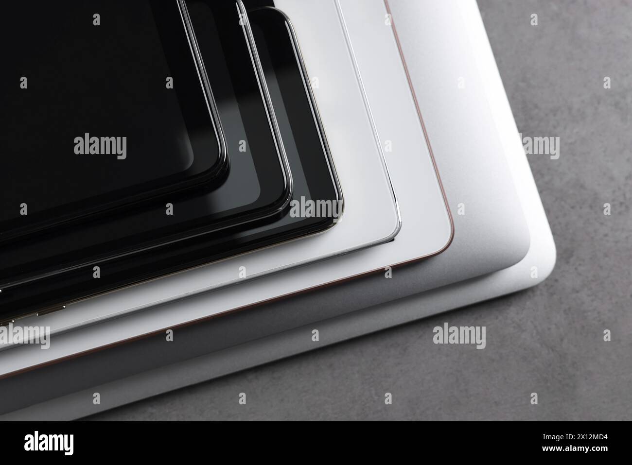 Many different modern gadgets on grey table, closeup Stock Photo