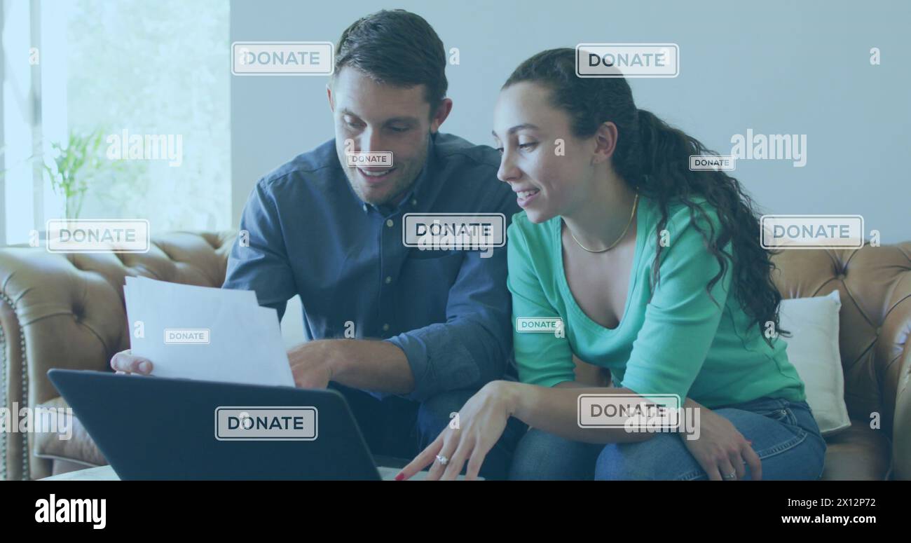 Image of donate texts over caucasian couple using laptop Stock Photo