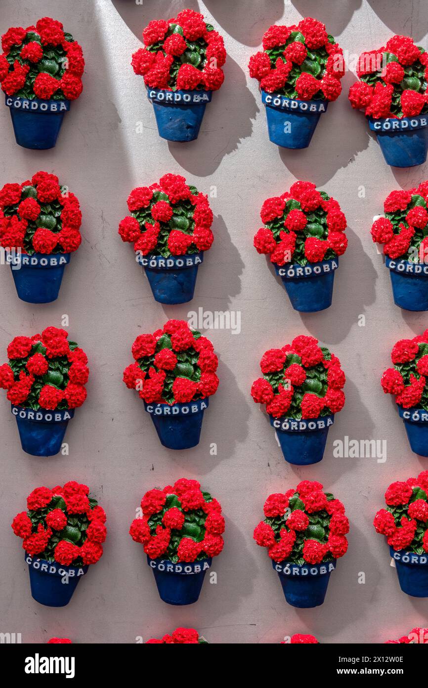 Small pots with flowers sold as souvenirs with the engraved name of the city of Cordoba, Andalusia, Spain. Stock Photo