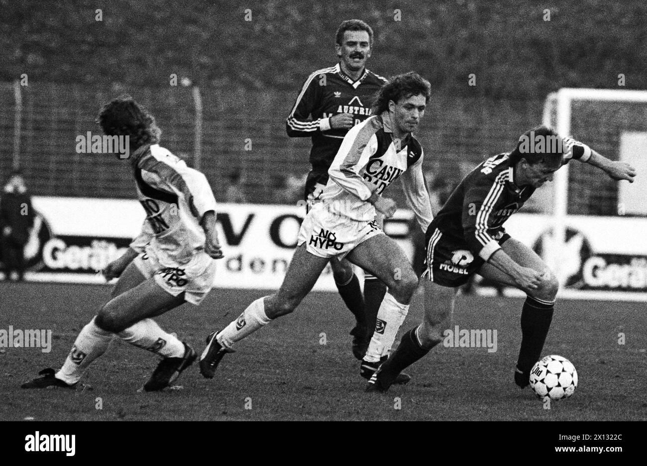 Football match between Admira and Austria on November 15th 1987. On the picture: Ernst Ogris (r.) fights against Manfred Kern - in the background Herbert Prohaska. - 19871115 PD0002 - Rechteinfo: Rights Managed (RM) Stock Photo