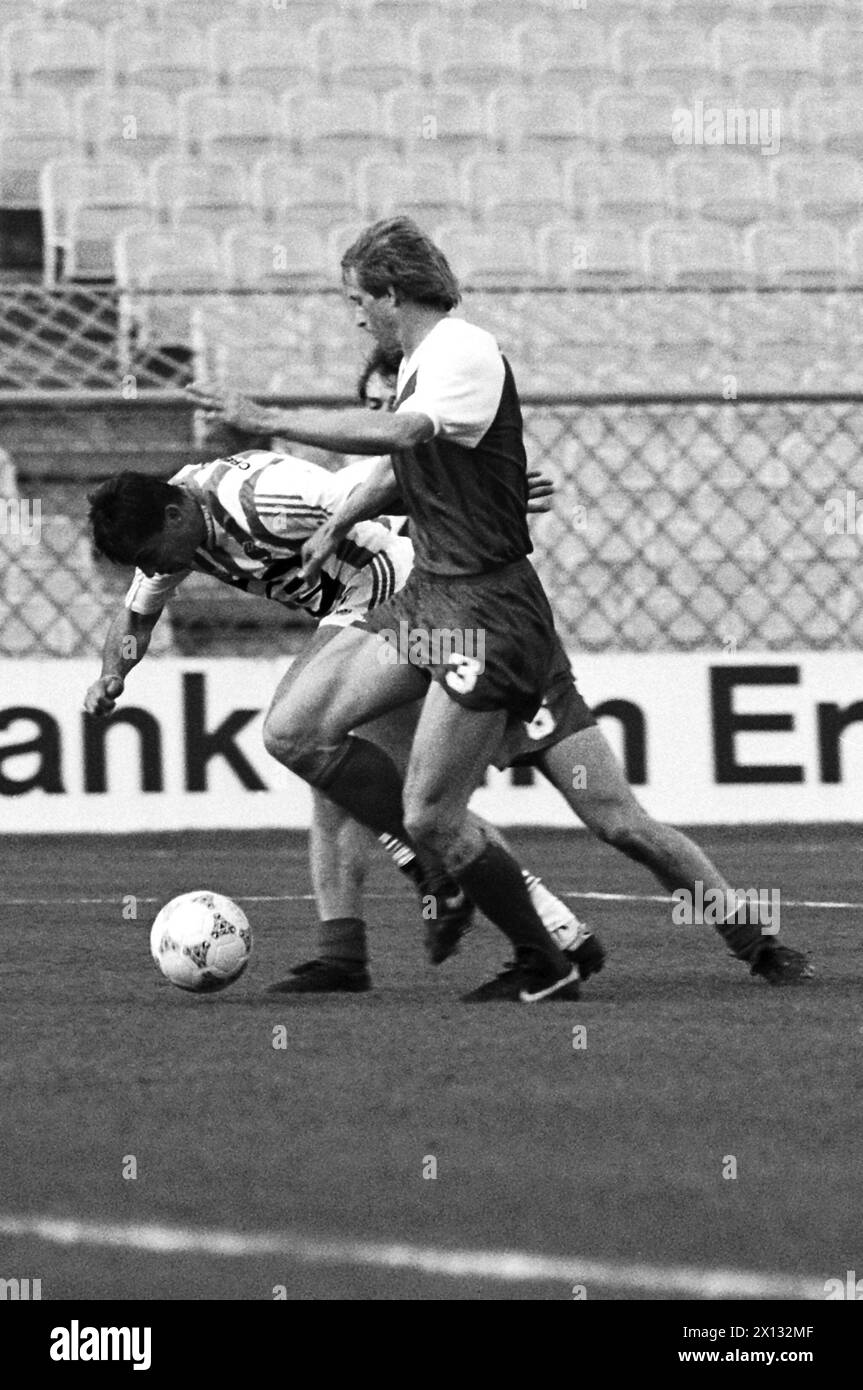 Football League master play-off between Rapid and Sportklub in Vienna's Hanappi Stadium on May 6th 1988. On the picture: Slatko Kranjcar (Rapid, c.) fights against Soeren Busk and Andreas Reisinger of Sportklub. - 19880506 PD0011 - Rechteinfo: Rights Managed (RM) Stock Photo