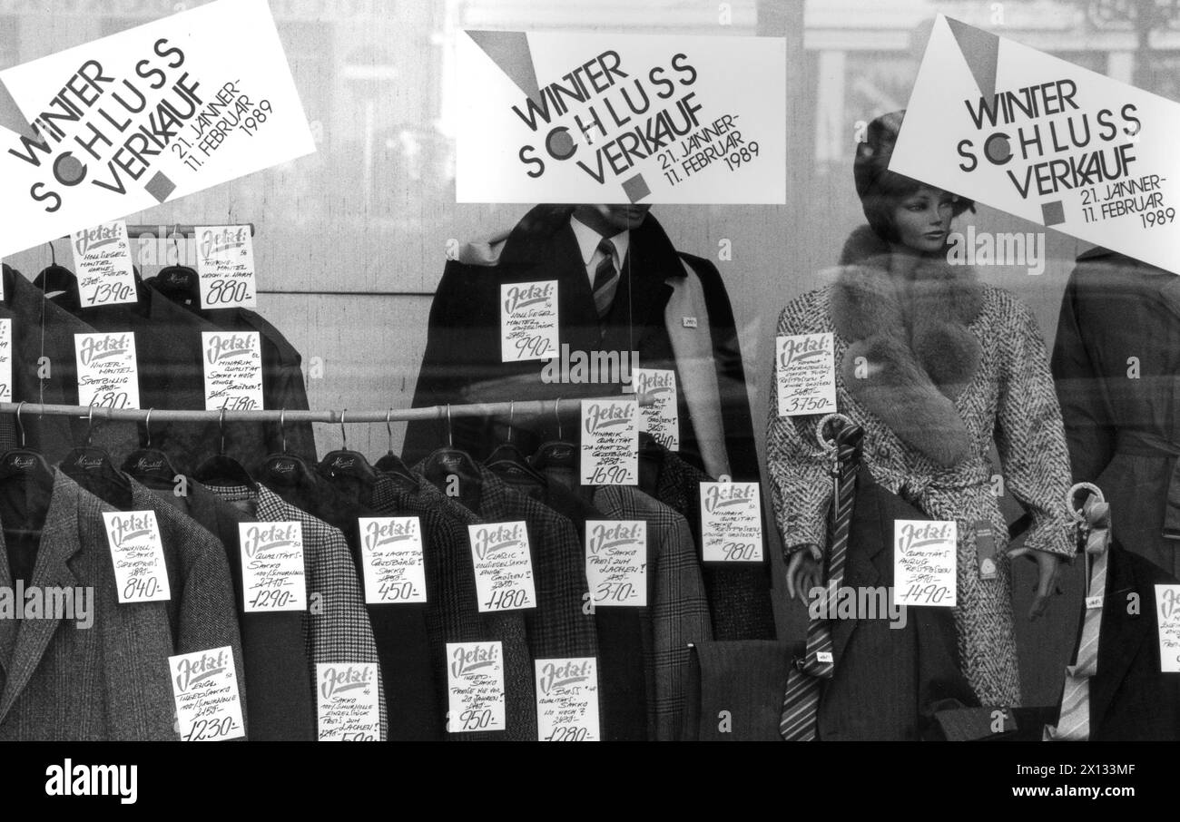 The display of a shop that advertises the winter sale with posters