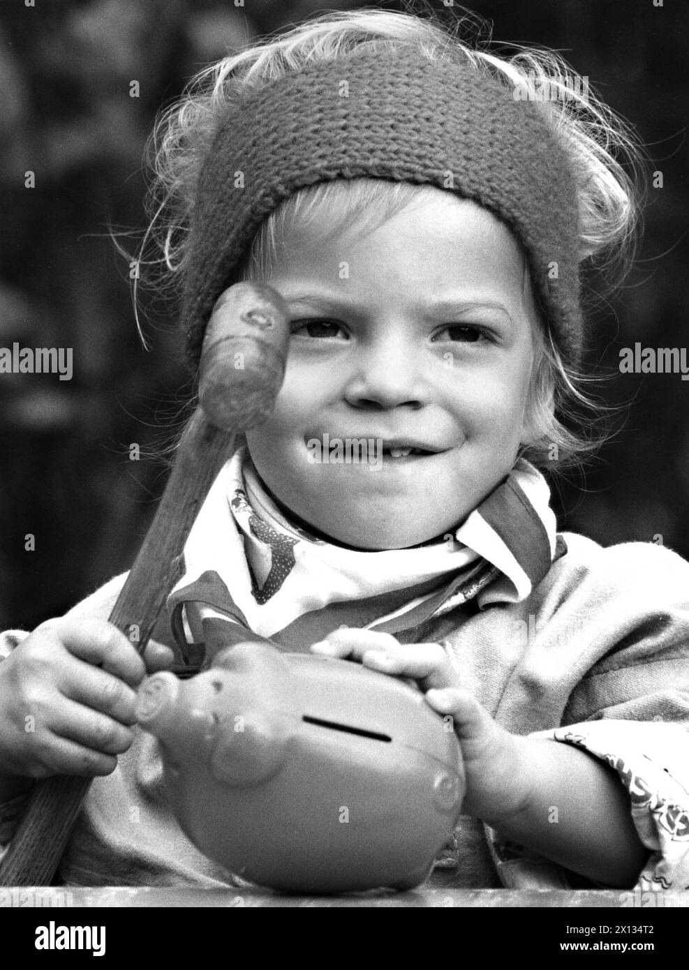 Feature for the 'World Save Day' A little boy kills his piggy bank