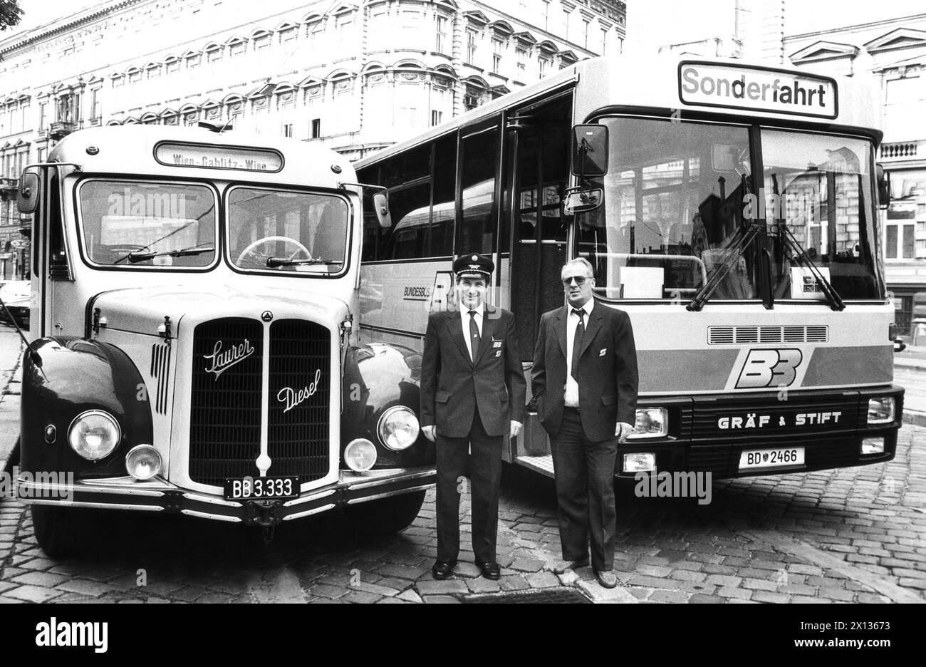 Vienna on June 16th 1990: 90th anniversary of Austria's scheduled public-transit busses. The first public bus went from Gablitz to Purkersdorf and was operated by the 'First Austrian-Hungarian Automobile Association for Personal and Freight Transports - Limited Partnership Adalbert Hermann & Co, Vienna'. In the picture: A 'Saurer' bus from 1953 with 120 HP and a new one by Graef & Stift from 1990 with 290 HP. - 19900616 PD0011 - Rechteinfo: Rights Managed (RM) Stock Photo