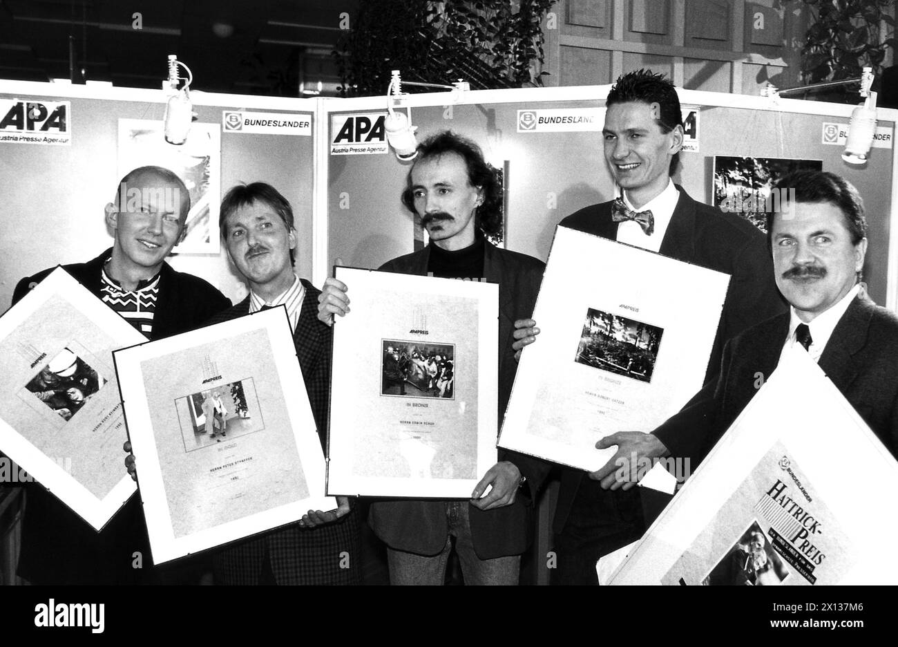 Vienna on February 1st 1991: Group portrtait with the laureates of the 'APA Photo Prize 1991: (l-r) Kurt Kleinrath (independent, 2nd rank), Peter Kleinrath (Kurier, 1st rank), Erwin Schuh (Volksstimme, 3rd rank), Robert Ratzer (Salzburger Nachrichten, 3rd rank) and A.H. Plankenauer (independent, 'Hattrick Prize for most dynamic press photo). - 19910201 PD0006 - Rechteinfo: Rights Managed (RM) Stock Photo