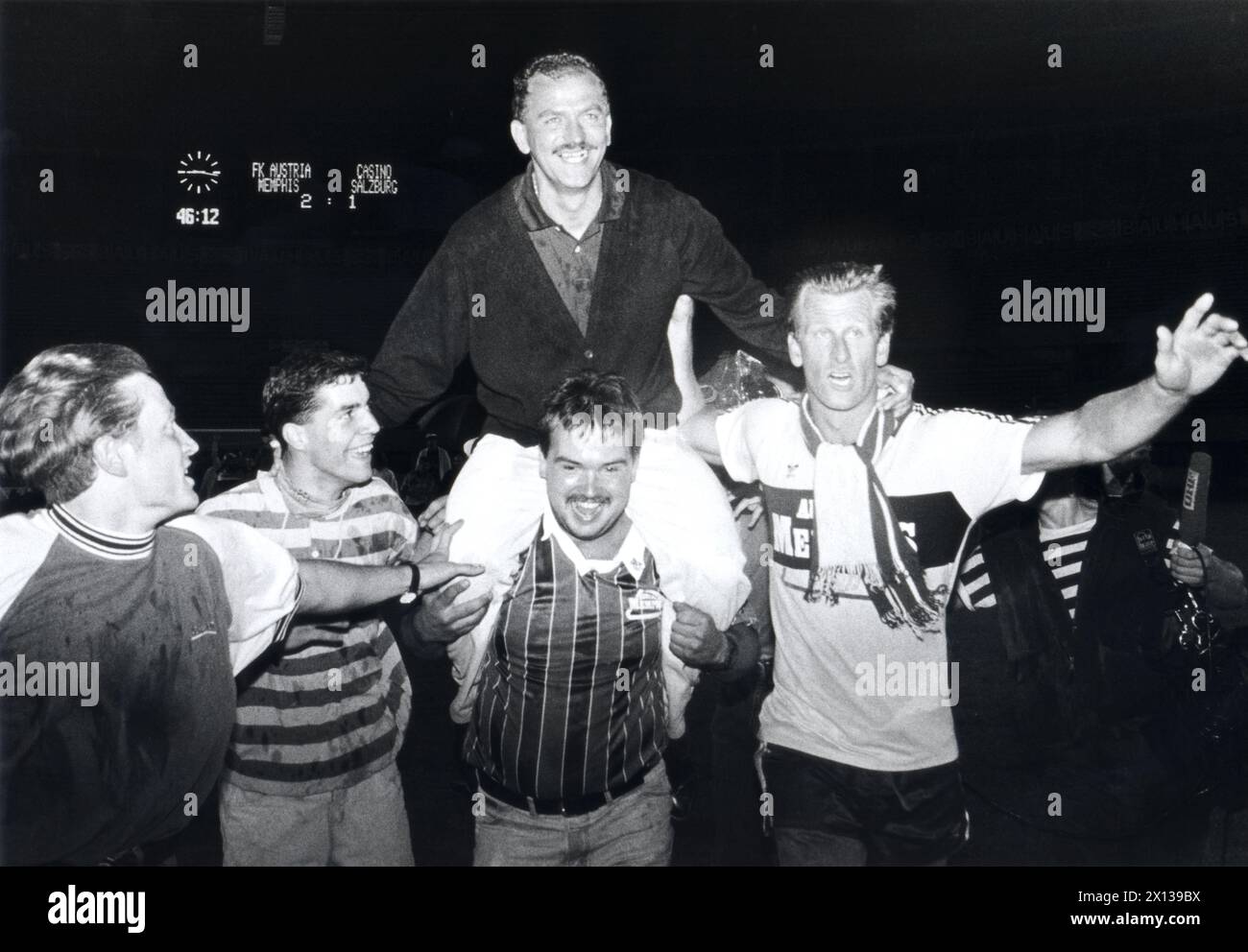 Herbert Prohaska, trainer of Austrian soccer team Austria Wien, is being carried by fans and soccer players after his team won the Austrian soccer championship on June 4th, 1992 in Vienna. - 19920604 PD0005 - Rechteinfo: Rights Managed (RM) Stock Photo