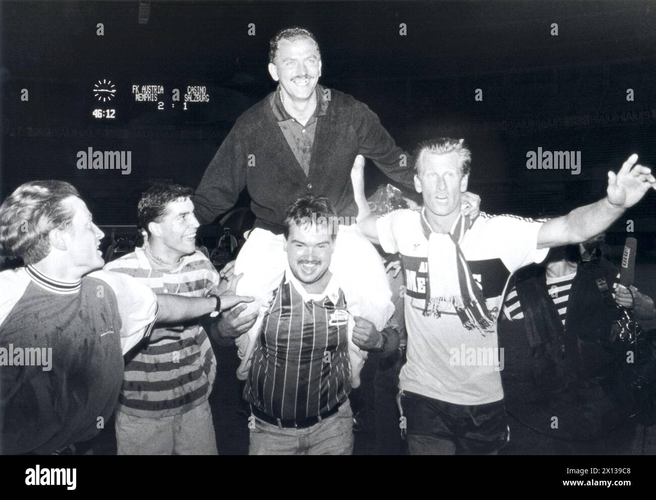 Herbert Prohaska, trainer of Austrian soccer team Austria Wien, is being carried by fans and soccer players after his team won the Austrian soccer championship on June 4th, 1992 in Vienna. - 19920604 PD0006 - Rechteinfo: Rights Managed (RM) Stock Photo