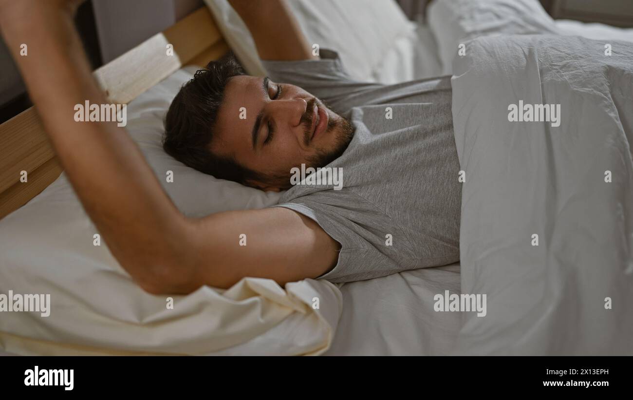 Hispanic man relaxing in a cozy bedroom interior, embracing serenity ...