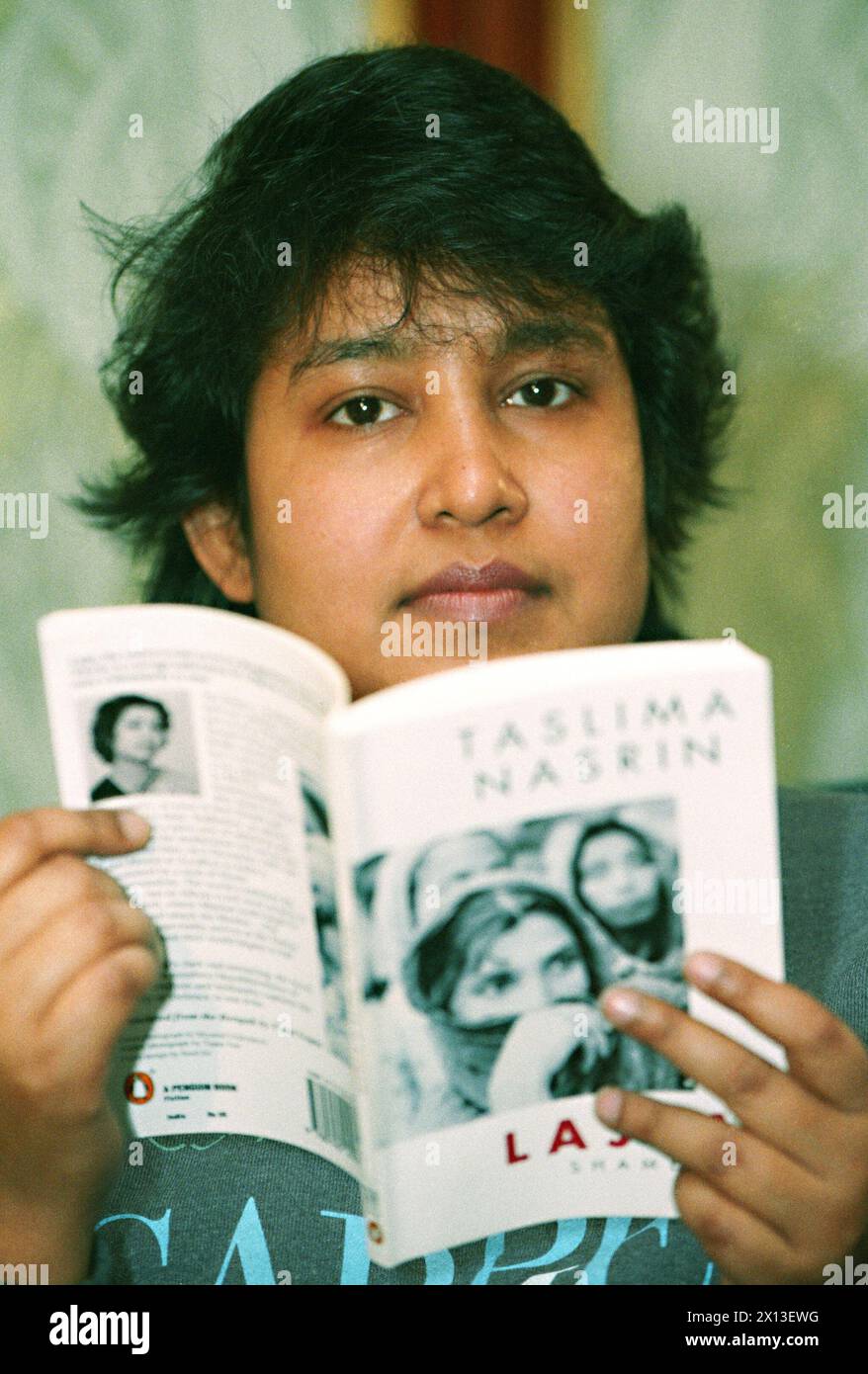 Taslima Nasreen,  Bengali Bangladeshi physician, writer, feminist human rights activist and secular humanist, threatened to death by Islamic fundamentalists, visited Vienna under substantial safety precautions on 13 December 1994. She presents her book Lajja-Shame. - 19941213 PD0001 - Rechteinfo: Rights Managed (RM) Stock Photo