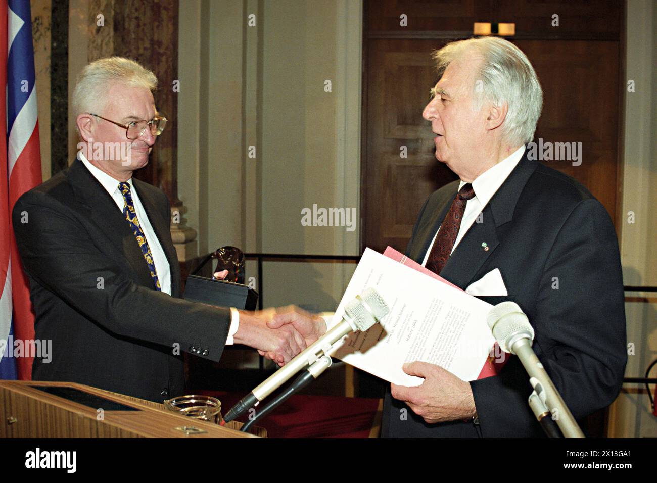 Vienna on September 2nd 1995: The Austrian shipowner Helmut Sohmen, who's living in Hong Kong, was awarded the 'Crystal Hawk' by Swarowski (Kristallhabicht) - a trophy of the World Union of Austrians abroads. In the picture: Helmut Sohmen (l.) and the president of the World Union of Austrians abroads, Carl Paul Wieland (r.) - 19950902 PD0008 - Rechteinfo: Rights Managed (RM) Stock Photo