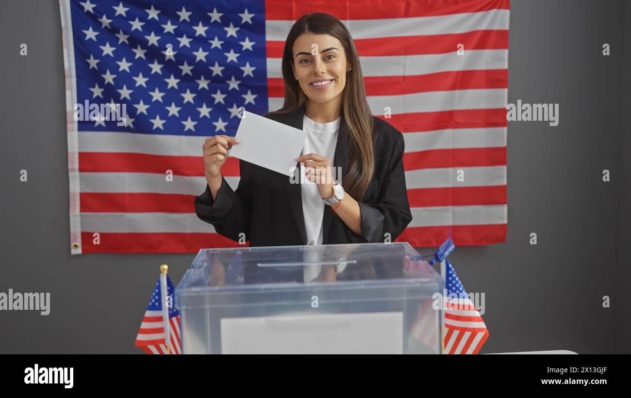 Smiling hispanic woman voting in american election, with us flag and ballot box Stock Photo