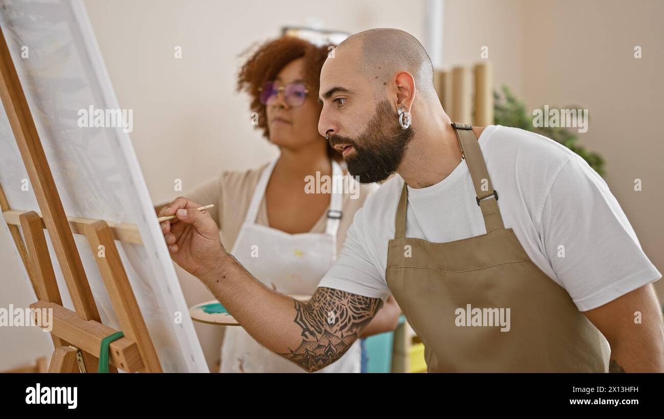 Two artists drawing together looking upset at art studio Stock Photo ...