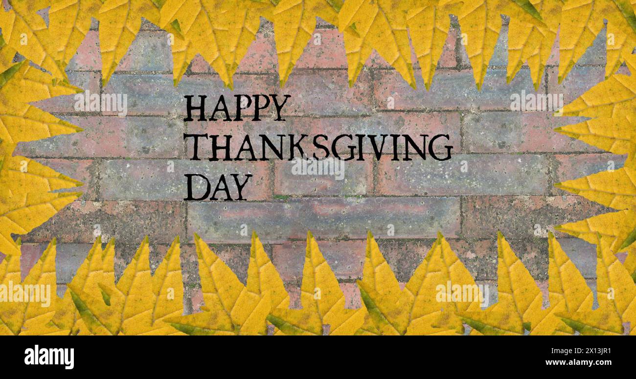 Image of happy thanksgiving day text over bricks with autumn leaves Stock Photo
