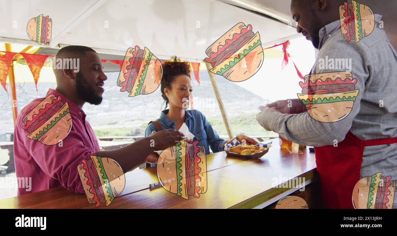 Image of hamburgers over african american male food vendor serving smiling customers Stock Photo