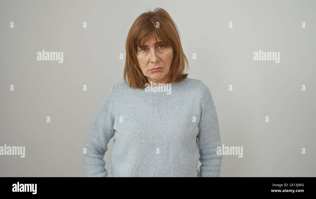 mature-woman-with-short-hair-wearing-a-sweater-on-a-white-background