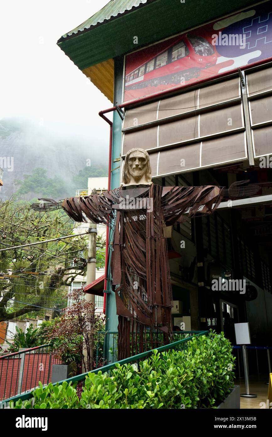 Smaller metal Christ The Redeemer statue at the Cosme Velho railway station. Stock Photo