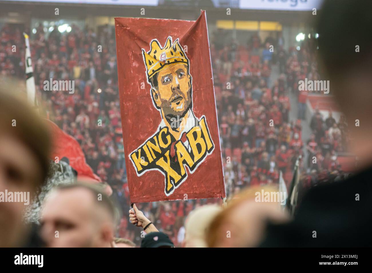 Leverkusen, North Rhine-Westphalia, Germany. 14th Apr, 2024. A Bayer Leverkusen fan holds up a sign reading ''King Xabi'', referring to head coach XABIER ALONSO in the Bundesliga matchday 29 match between Bayer Leverkusen and Werder Bremen in the BayArena in Leverkusen, North Rhine-Westphalia, Germany on April 14, 2024. Credit: ZUMA Press, Inc./Alamy Live News Stock Photo