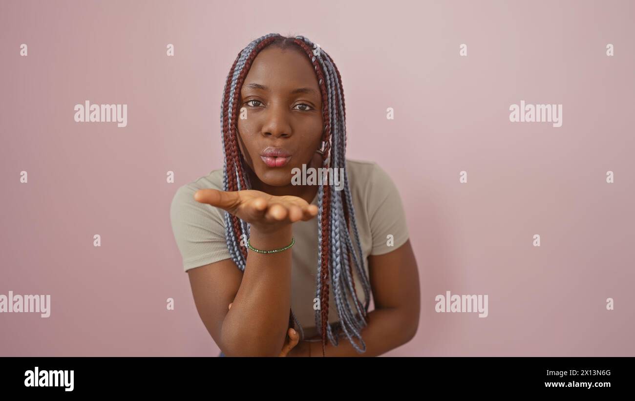 Woman braids blowing kiss hi-res stock photography and images - Alamy